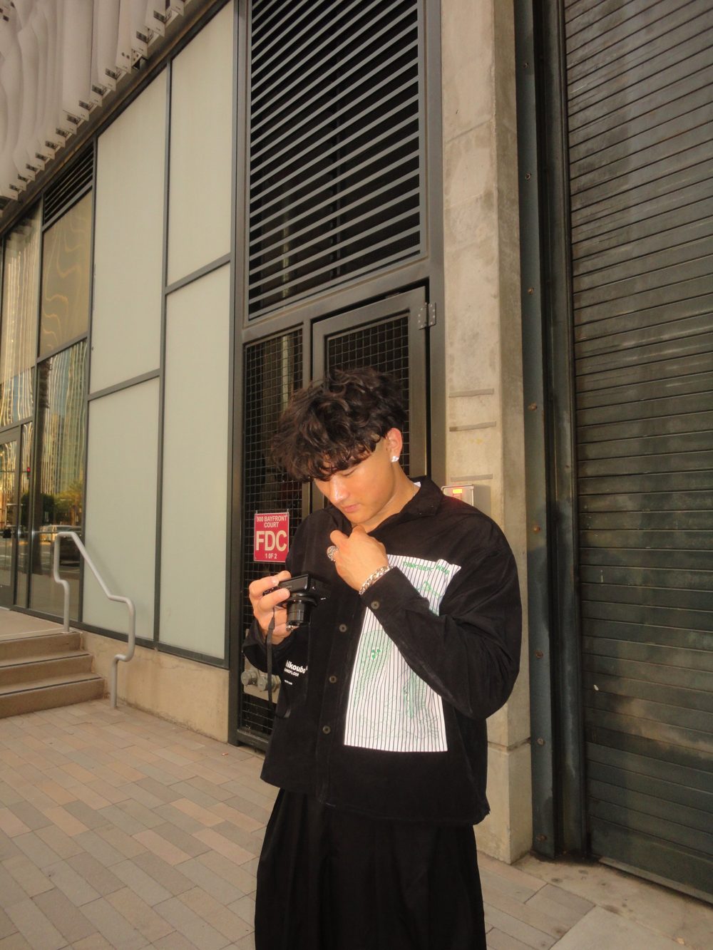 Johnny Chai checking footage on a camera